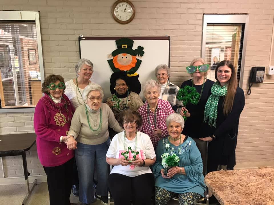 FCE Members posing with st. patricks day decorations